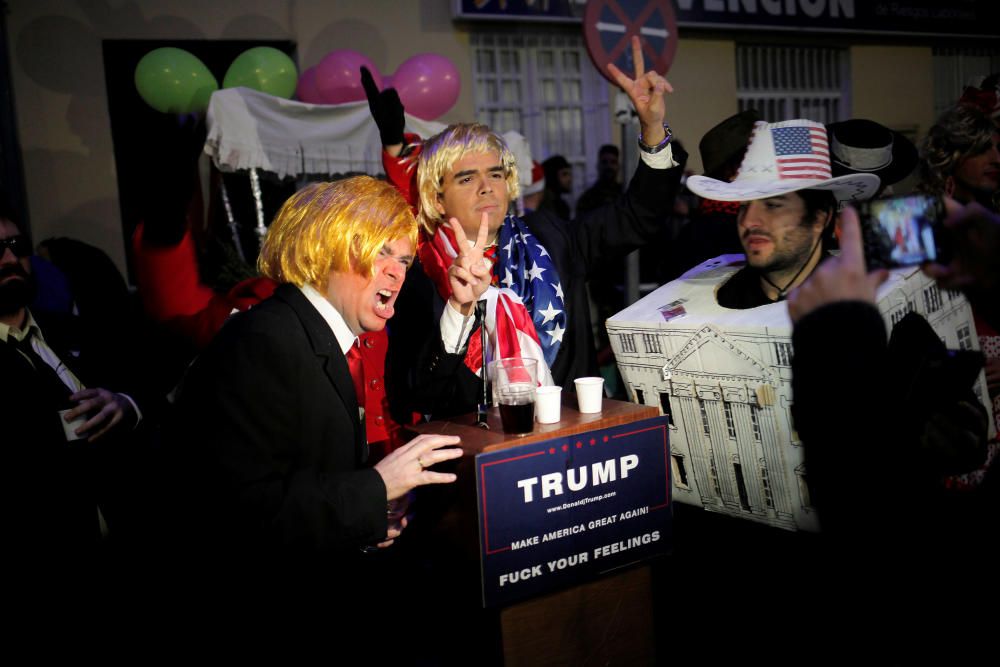 Revellers dressed up as Donald Trump and the ...