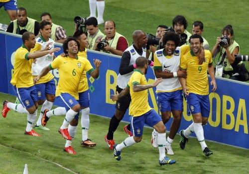 Brazil's Fred celebrates with teammates after scoring against England during their international friendly soccer match at the Maracana Stadium in Rio de Janeiro