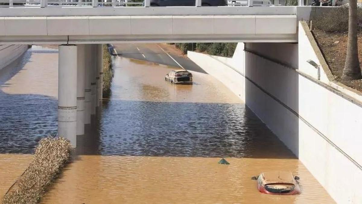 Two cars trapped on the airport motorway during the October storm last year.