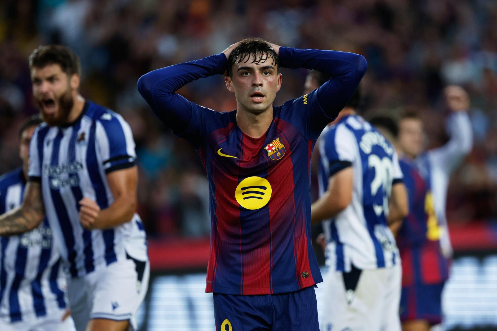 Barcelona's Pedri reacts after missing a chance to score during a Spanish La Liga soccer match between FC Barcelona and Real Sociedad at the Lluis Companys Olympic Stadium in Barcelona, Spain, Sunday, Sept. 28, 2025. (AP Photo/Joan Monfort). EDITORIAL USE ONLY/ONLY ITALY AND SPAIN