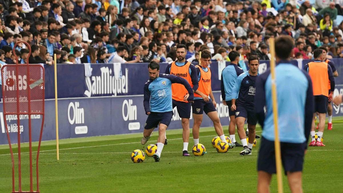 Entrenamiento a puertas abiertas de la pasada temporada en La Rosaleda.