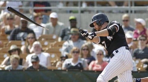 White Sox's Keppinger breaks his bat against the Brewers during their MLB Cactus League spring training baseball game in Glendale