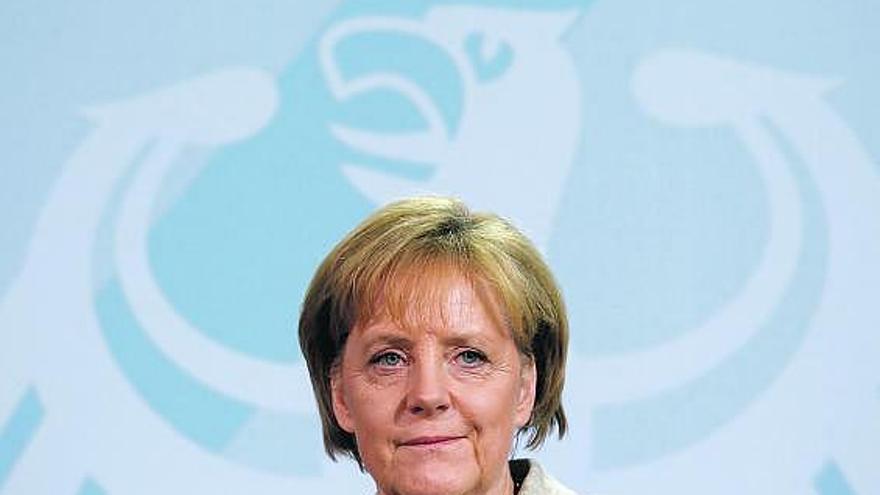 Ángela Merkel, ayer, durante la rueda de prensa.