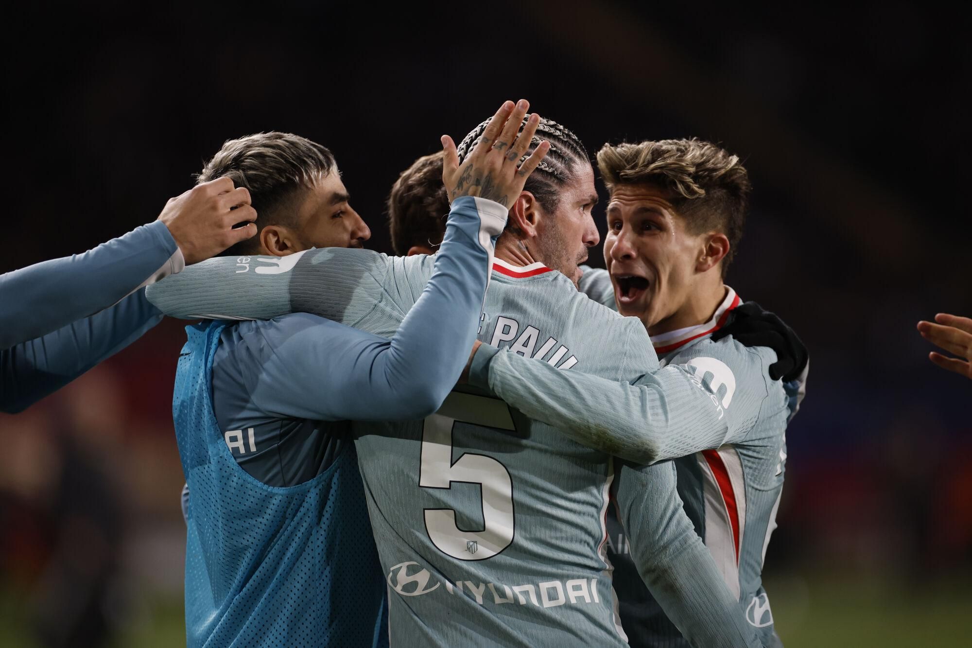 Atletico's Rodrigo de Paul celebrates after scoring the 1-1 tier during a Spanish LaLiga EA Sports soccer match between FC Barcelona and Atletico de Madrid at Lluis Companys stadium in Barcelona, Spain, 21 December 2024. EFE/ Alberto Estevez