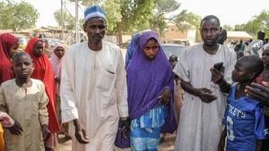 zentauroepp42599997 a girl released by boko haram walks with his father  l  in d180321200355