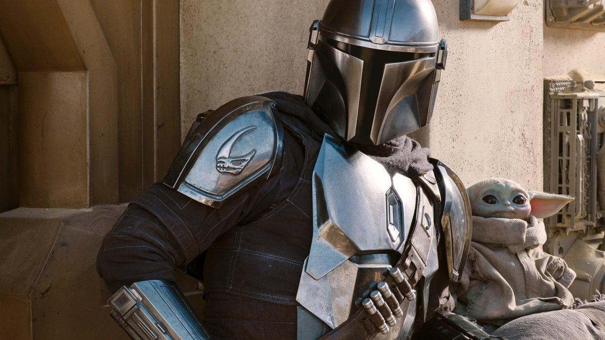 The Mandalorian (Pedro Pascal) and the Child in THE MANDALORIAN, season two, exclusively on Disney+