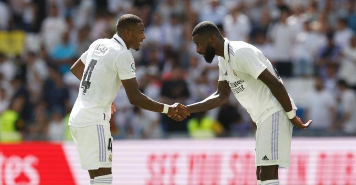 Alaba and Tchouameni greet each other before a Real Madrid match this season