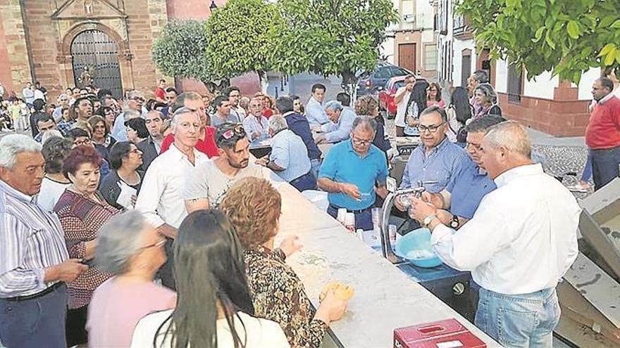 Los vecinos, con el patrón del agricultor