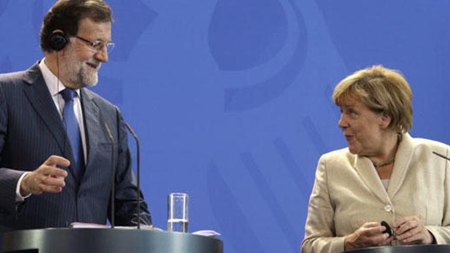 Rajoy y Merkel, en rueda de prensa.