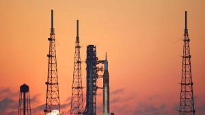 TOPSHOT - NASAs Artemis II Space Launch System (SLS) rocket and Orion spacecraft are seen at sunrise at Launch Pad 39B at the Kennedy Space Center in Cape Canaveral, Florida on March 24, 2026. NASA on March 19 began returning its towering SLS rocket and Orion spacecraft to its Florida launch pad ahead of a planned flyby of the Moon, after completing necessary repairs. The next launch window opens on April 1. (Photo by Gregg Newton / AFP)