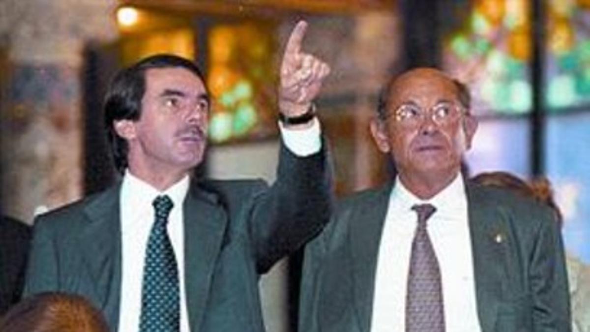 Aznar y Millet, durante una visita al Palau, en octubre del 2002.