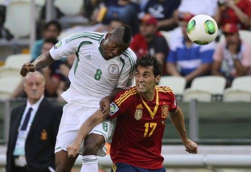 Nigeria's Ideye fights for the ball with Spain's Arbeloa during their Confederations Cup Group B soccer match at the Estadio Castelao in Fortaleza