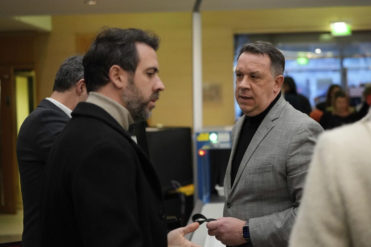 The son of Gisele Pelicot, David, right, arrives in the Avignon courthouse, southern France, Thursday, Dec. 19, 2024. (AP Photo/Lewis Joly)