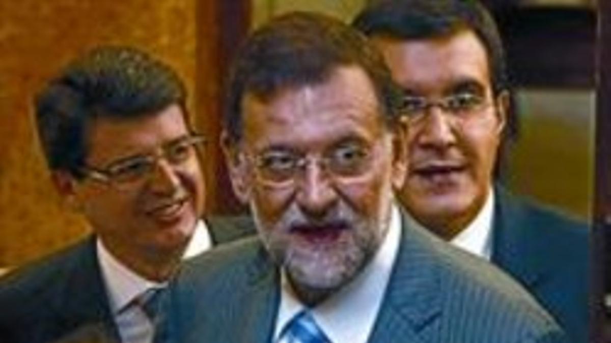 El líder del PP, Mariano Rajoy, junto a Soraya Sáenz de Santamaría.