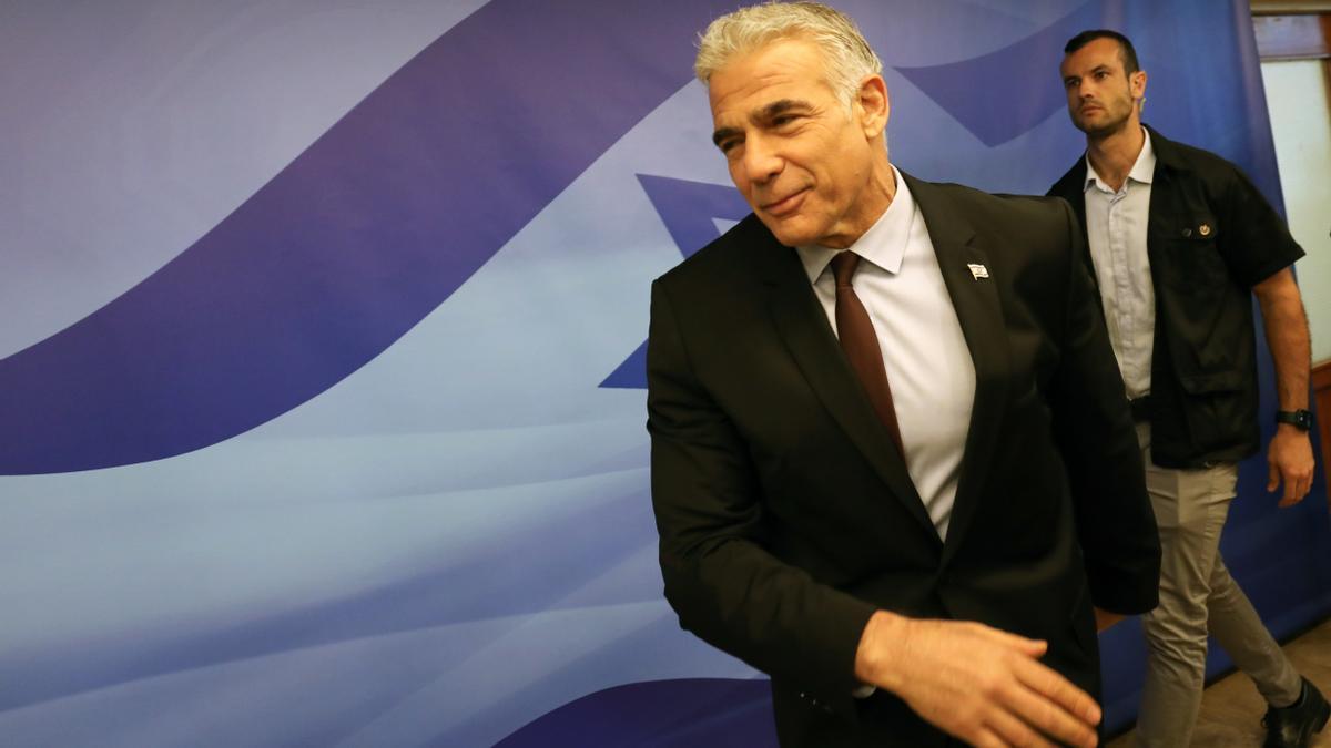 Israel's caretaken Prime Minister Yair Lapid chairs the first cabinet meeting