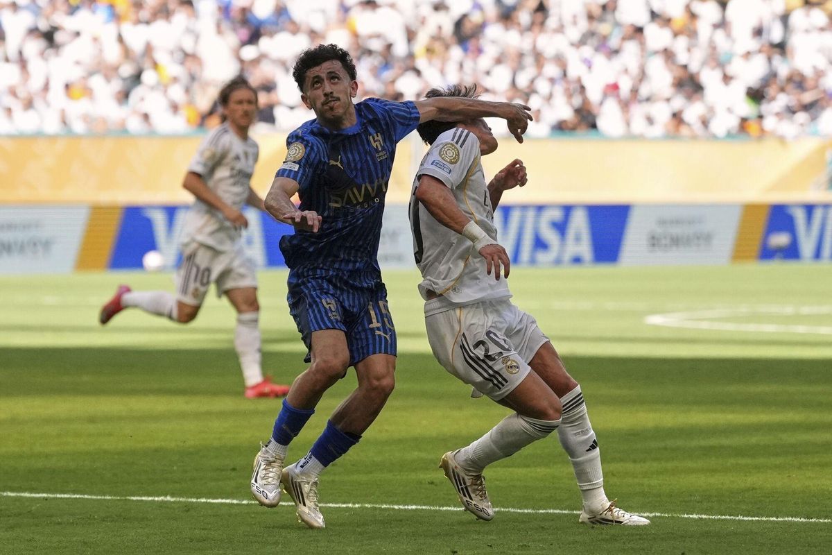 Al-Hilals Mohammed Al-Qahtani is called for a penalty on Real Madrids Fran Garcia during the Club World Cup group H soccer match between Real Madrid and Al Hilal in Miami Gardens, Fla., Wednesday, June 18, 2025. (AP Photo/Rebecca Blackwell)