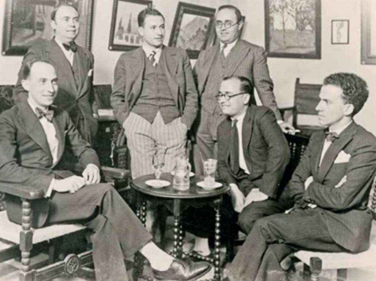 Reunió dels fundadors de Nostra Novel·la. D’esquerra a dreta, drets: Faust Hernández Casajuana, Josep Bolea i Adolf Pizcueta. Asseguts: Enric Duran i Tortajada, Francesc Almela i Vives i Maximilià Thous Llorens.