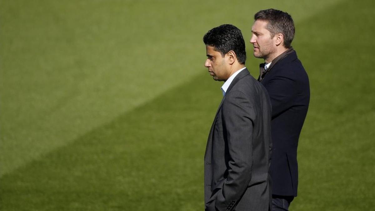 Létang, a la derecha, junto al presidente del PSG, Olivier Létang