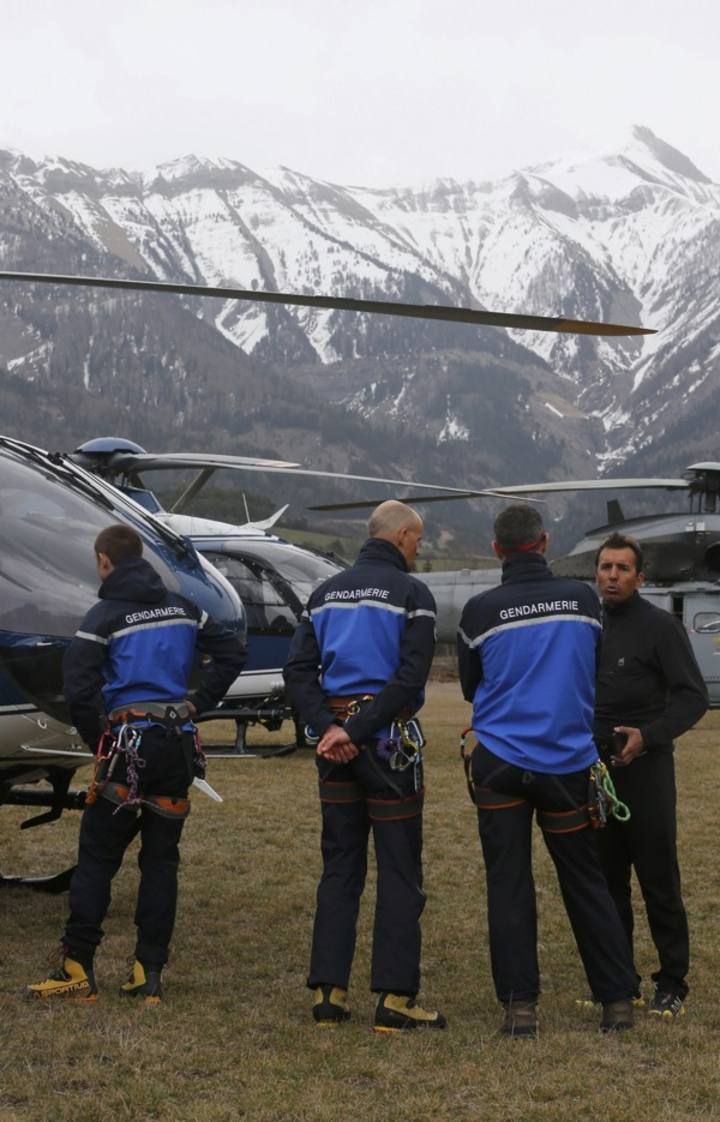 French Gendarmerie Alpine rescue units gather on a field as they prepare to reach the crash site of an Airbus A320