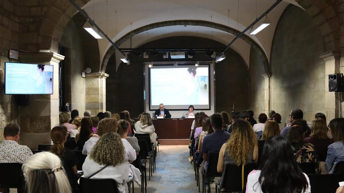 Manel Valls i Sílvia Graella a la inauguració de la jornada a la sala gòtica de Sant Andreu