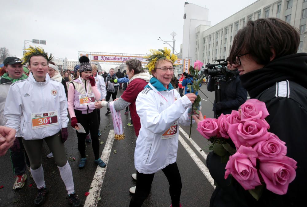 Women participate in the "Beauty Run" to mark ...