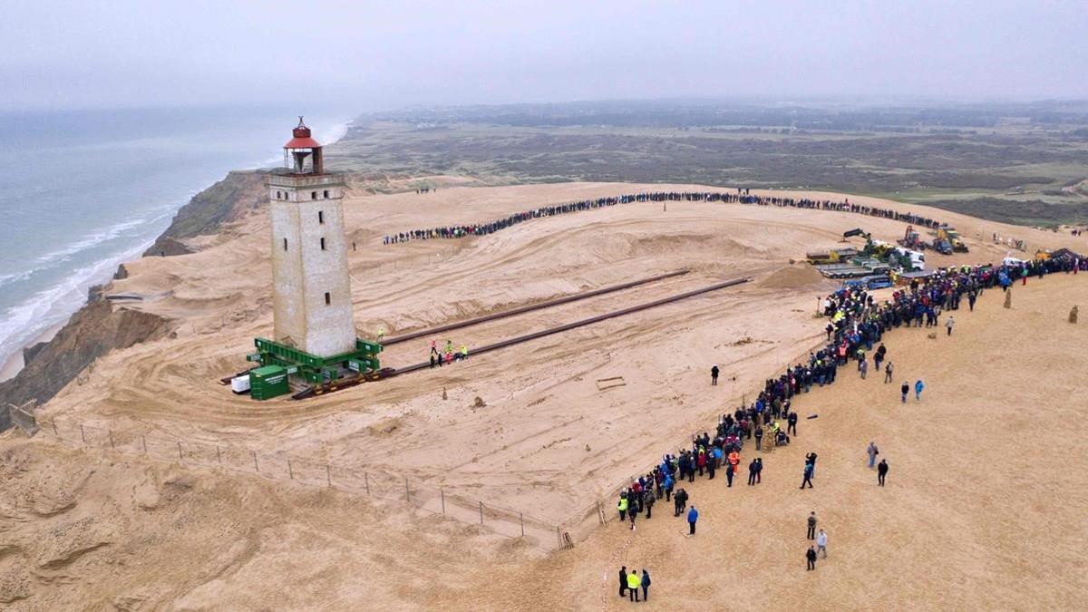 zentauroepp50518894 people look on as the lighthouse in rubjerg knude is being m191022165708