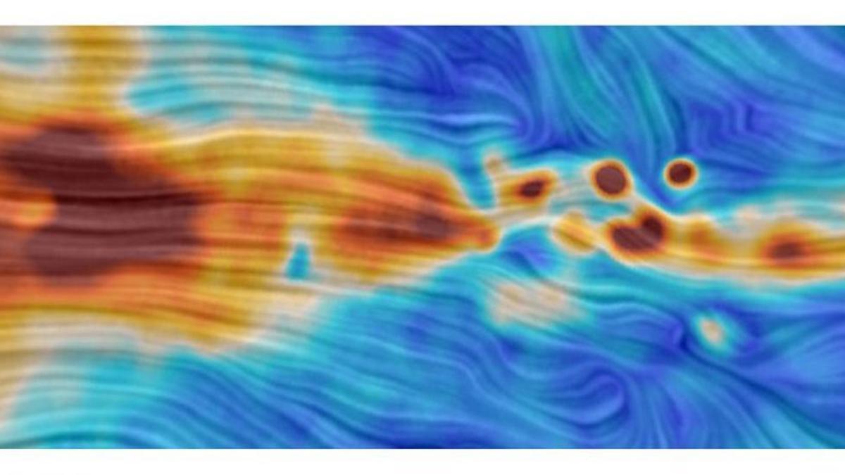 En color se muestra la emisión polarizada de microondas medida por Quijote. El patrón de trazos superpuestos indica la dirección de las líneas de campo magnético