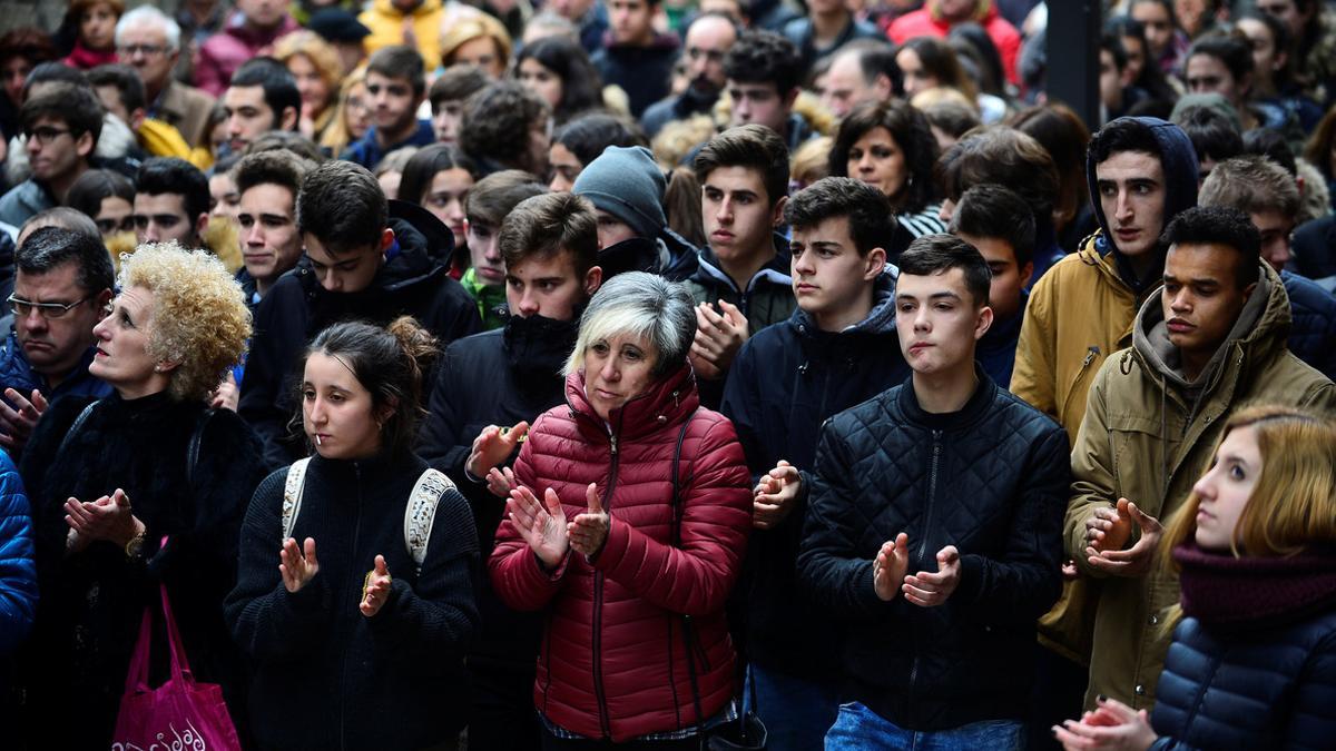 Neighbours of Inocencio Alonso, Basque policeman who suffered a fatal heart attack while policing clashes between Athletic Bilbao and Spartak fans, take part in a protest in Ermua