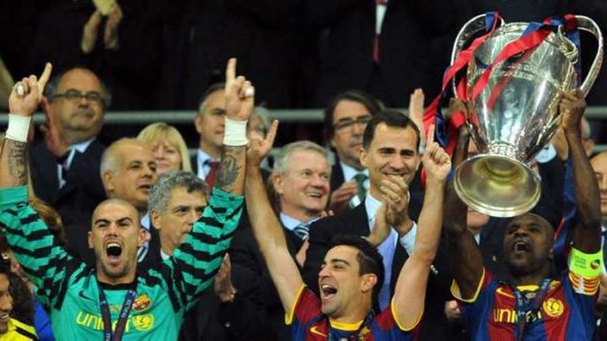 Víctor Valdés, Xavi Hernández y Eric Abidal, ayer.