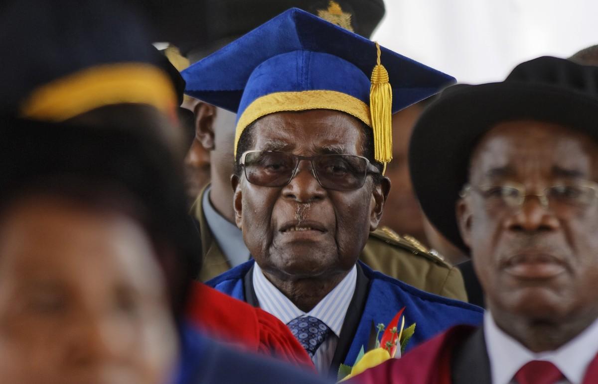 Zimbabwe s President Robert Mugabe  center  arrives to preside over a student graduation ceremony at Zimbabwe Open University on the outskirts of Harare  Zimbabwe Friday  Nov  17  2017  Mugabe is making his first public appearance since the military put him under house arrest earlier this week   AP Photo Ben Curtis