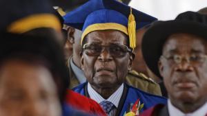 Zimbabwe s President Robert Mugabe  center  arrives to preside over a student graduation ceremony at Zimbabwe Open University on the outskirts of Harare  Zimbabwe Friday  Nov  17  2017  Mugabe is making his first public appearance since the military put him under house arrest earlier this week   AP Photo Ben Curtis