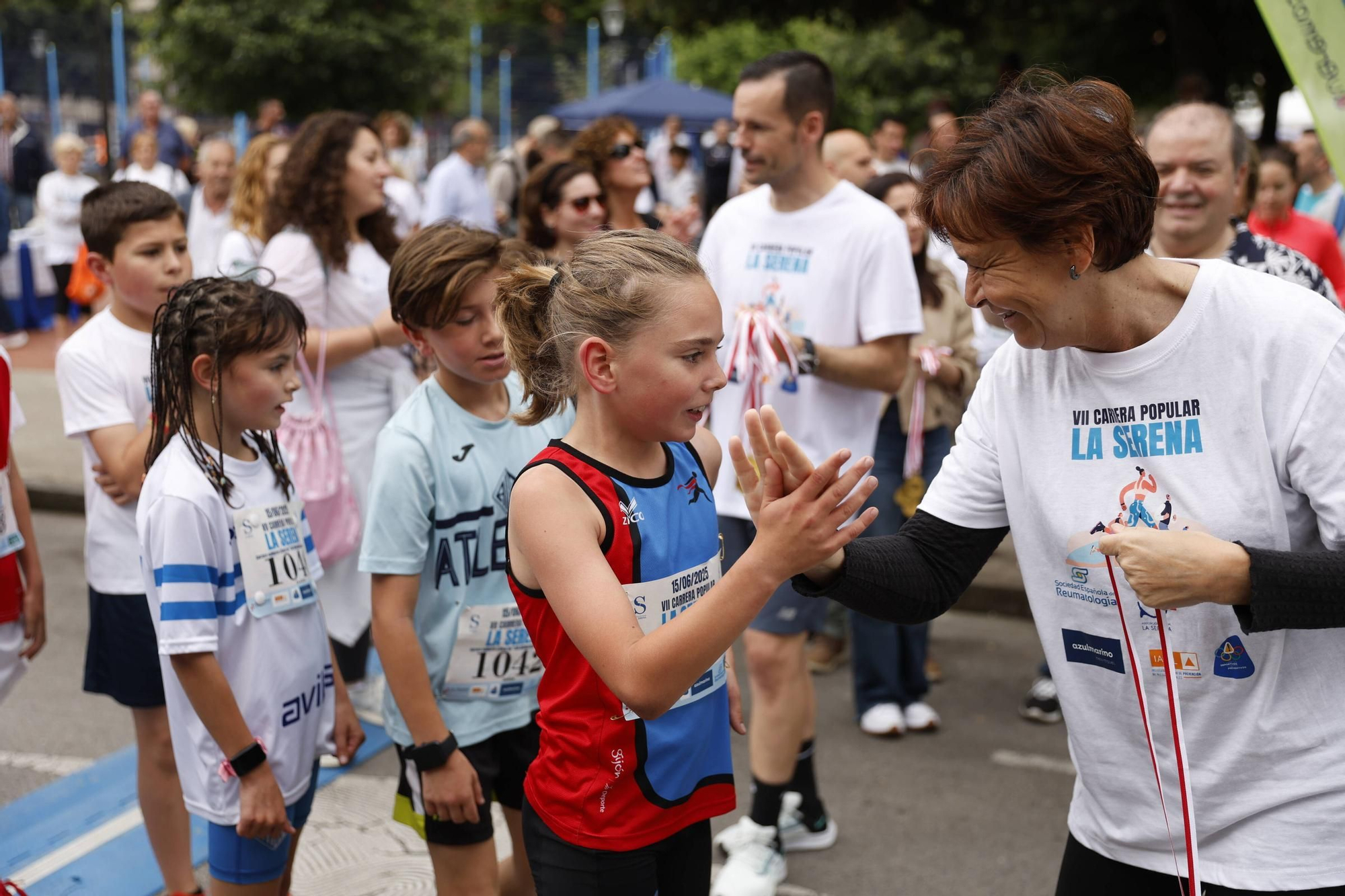 La carrera popular solidaria en El Llano, en Gijón, en imágenes