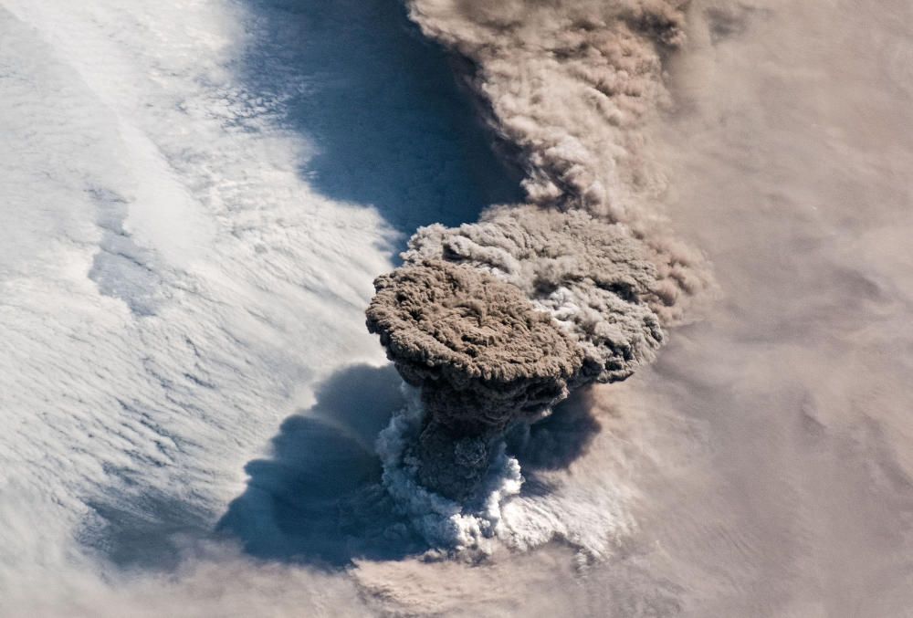 A NASA handout photo of a large volcanic ash and ...