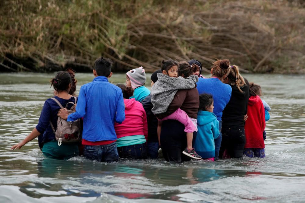 Migrants cross the Rio Bravo in Piedras Negras