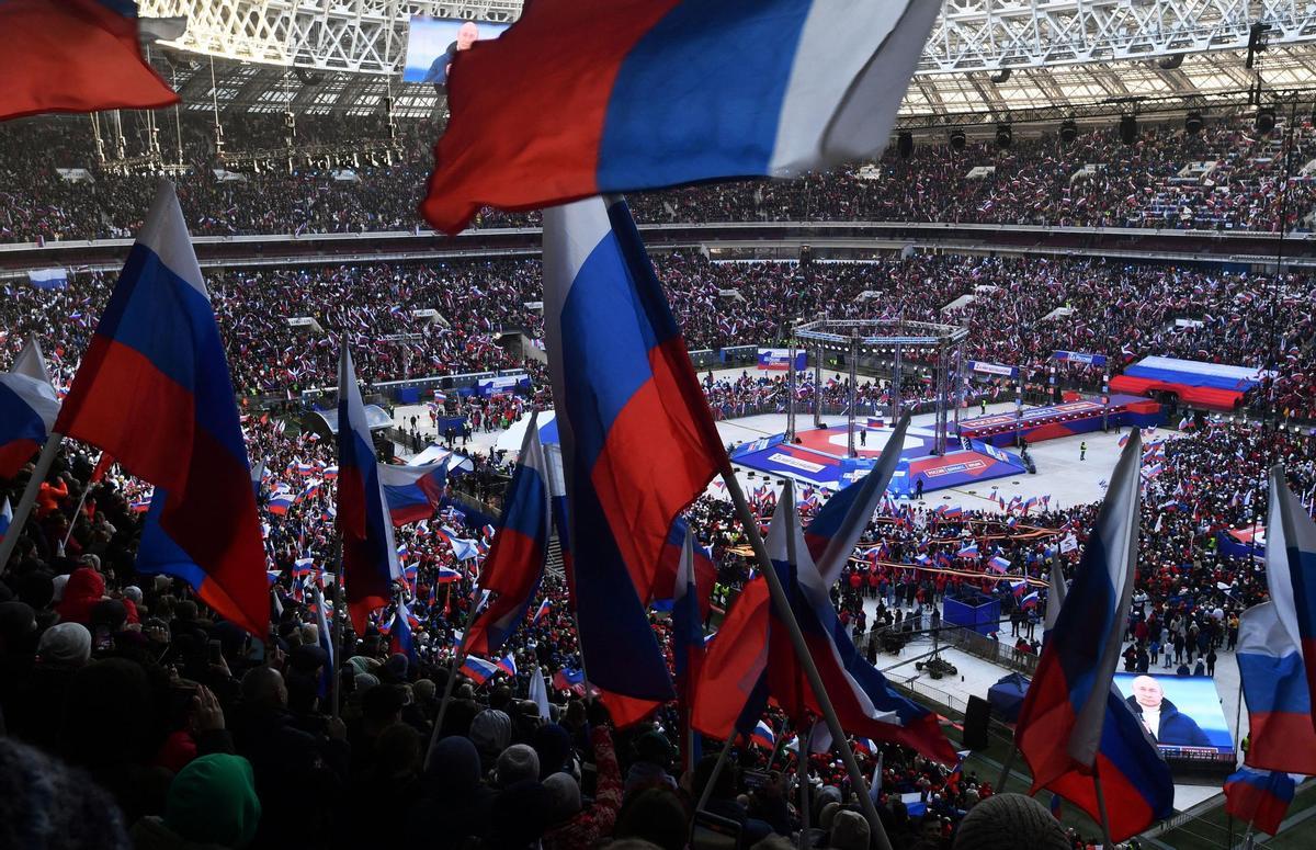 Russian President Vladimir Putin attends a concert marking the eighth anniversary of Russia's annexation of Crimea in Moscow