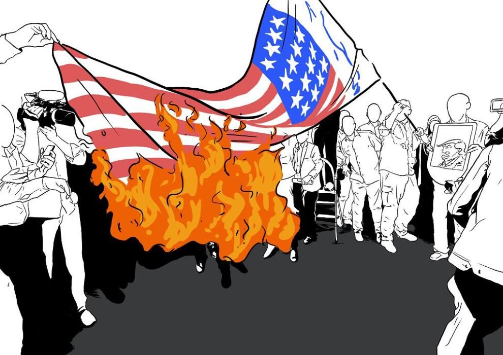 Iraníes queman banderas estadounidenses durante una manifestación contra EE UU
