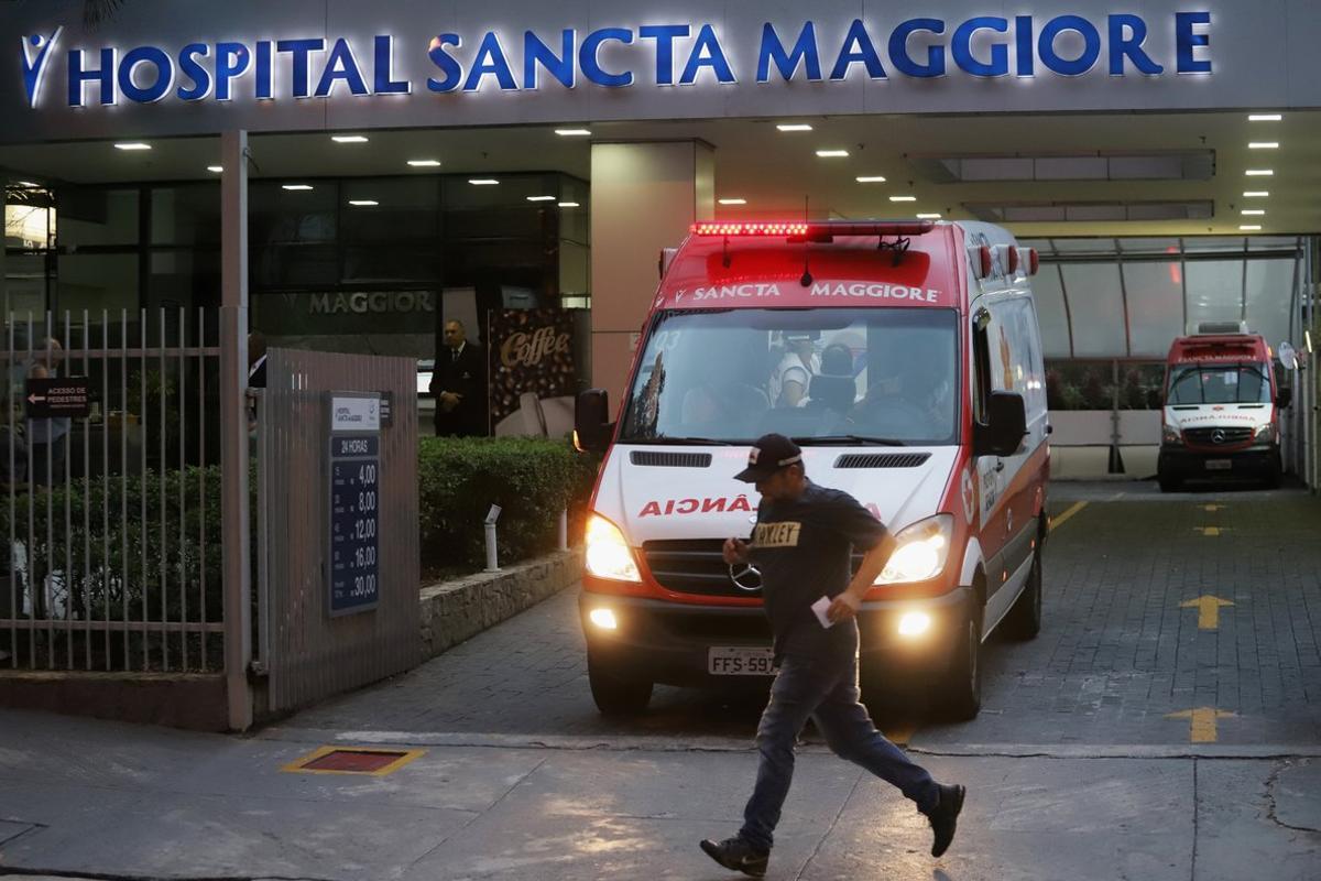 A man passes by the entrance of the Sancta Maggiore Hospital amid the coronavirus disease (COVID-19) in Sao Paulo, Brazil March 17, 2020. REUTERS/Rahel Patrasso