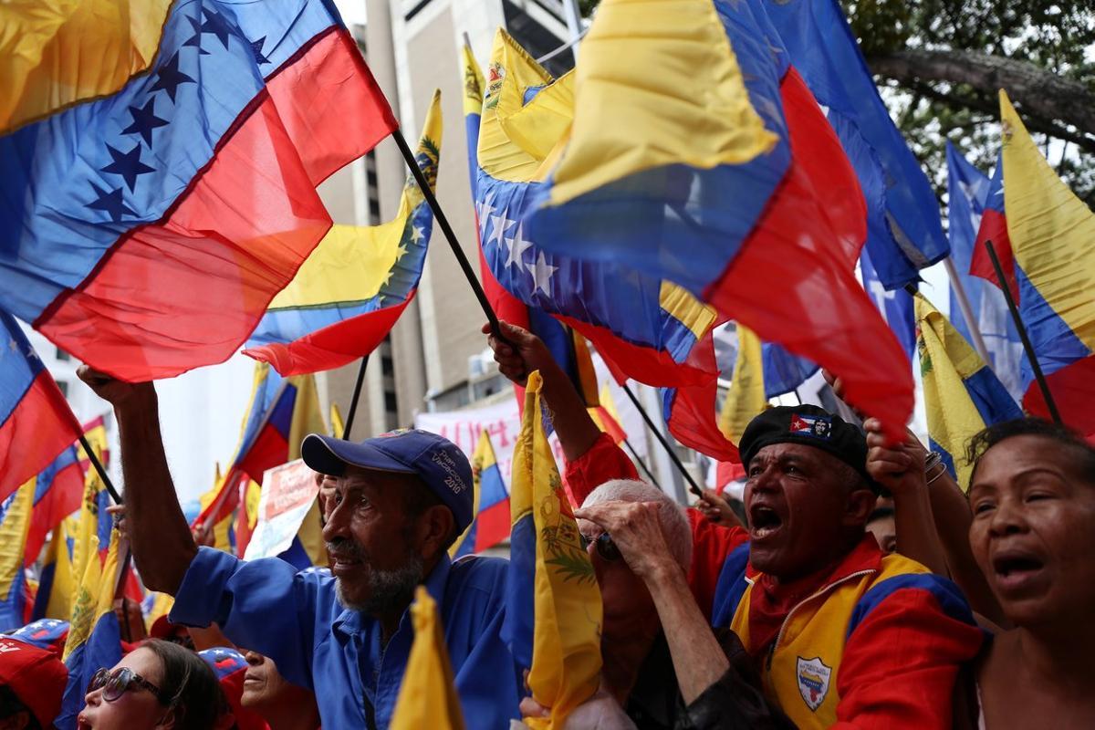 Supporters of Venezuela s President Nicolas Maduro take part in a demonstration to commemorate the Bicentennial of the Boyaca Battle at the National Pantheon in Caracas  Venezuela August 7  2019  REUTERS Fausto Torrealba NO RESALES  NO ARCHIVE