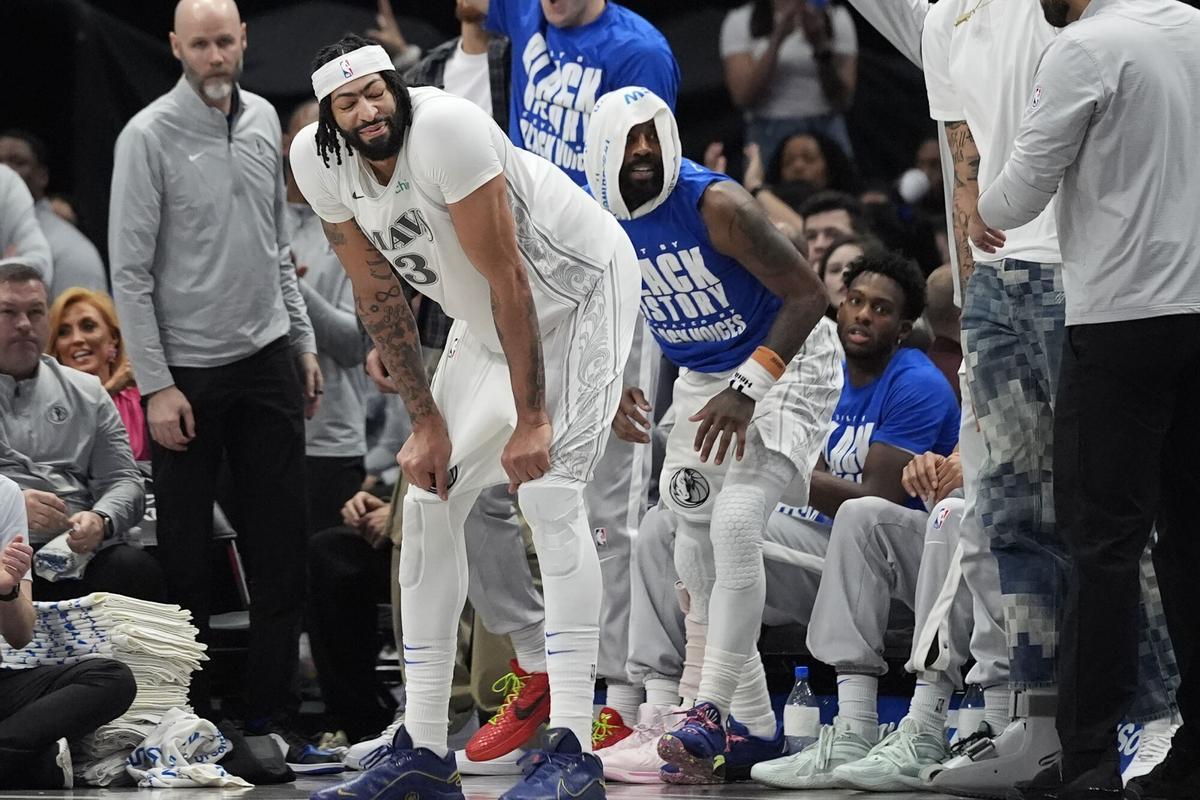 Dallas Mavericks forward Anthony Davis (3) waits for a time out in front of the bench during the third quarter of an NBA basketball game against the Houston Rockets Saturday, Feb. 8, 2025, in Dallas. (AP Photo/LM Otero)