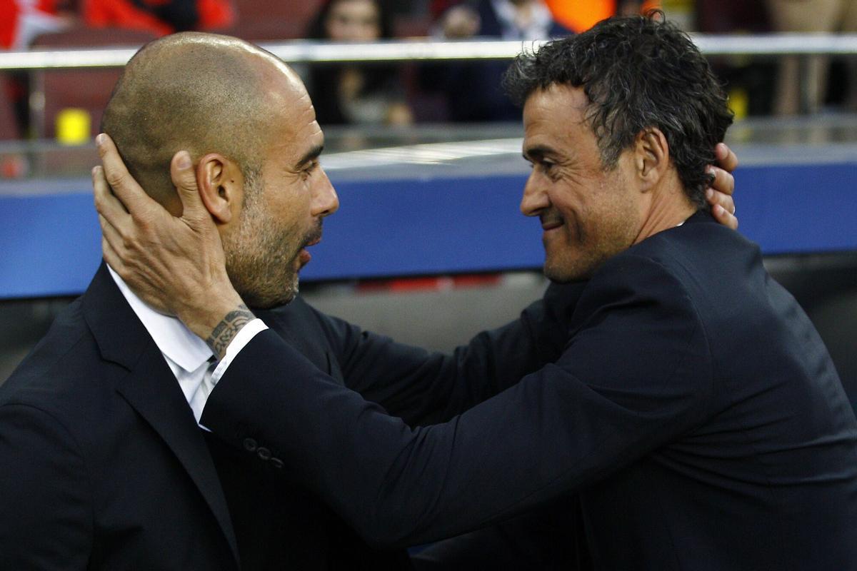 TOPSHOTSBayern Munich's Spanish head coach Pep Guardiola (L) and Barcelona's coach Luis Enrique greet each other before the UEFA Champions League football match FC Barcelona vs FC Bayern Muenchen at the Camp Nou stadium in Barcelona on May 6, 2015. AFP PHOTO/ QUIQUE GARCIA. horizontal