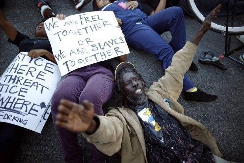 Protesters lie in an intersection during a demonstration, following the Monday grand jury decision in the shooting of Michael Brown in Ferguson, Missouri, in Los Angeles