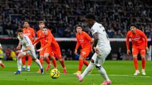 Real Madrids Vinicius Junior scores his sides 2nd goal from the penalty spot during the Spanish La Liga soccer match between Real Madrid and Real Sociedad in Madrid, Spain, Saturday, Feb. 14, 2026. (AP Photo/Manu Fernandez)