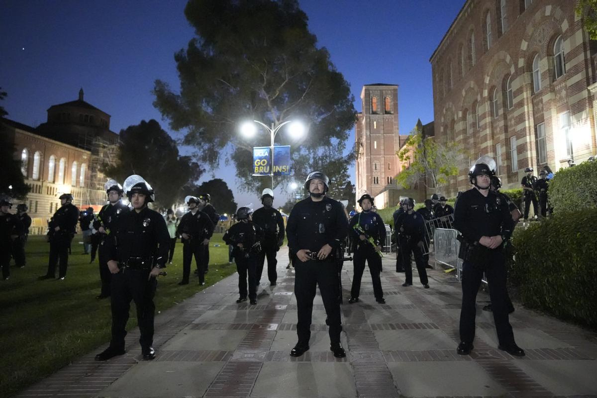 Police stage on the UCLA campus near an encampment set up by pro-Palestinian demonstrators Wednesday, May 1, 2024, in Los Angeles. (AP Photo/Ryan Sun)