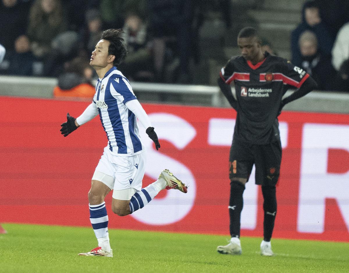 Real Sociedad's Takefusa Kubo, left, celebrates after scoring in a Europa League soccer match between FC Midtjylland and Real Sociedad at MCH Arena in Herning, Denmark, Thursday, Feb. 13, 2025. (Henning Bagger/Ritzau Scanpix via AP). EDITORIAL USE ONLY/ONLY ITALY AND SPAIN