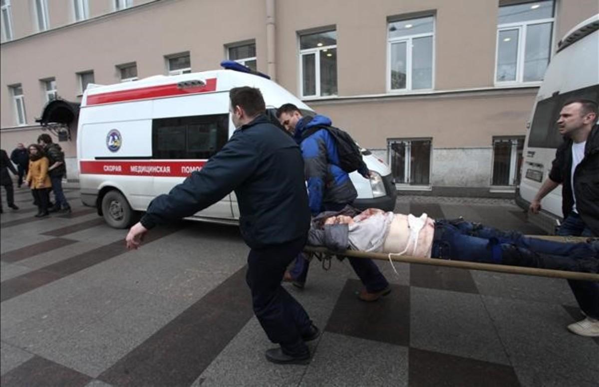 abertran37915718 men carry an injured person on a stretcher outside technolog170403153340