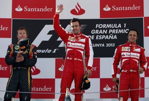 Ferrari Formula One driver Alonso of Spain waves to the crowd after winning the Spanish F1 Grand Prix in Montmelo