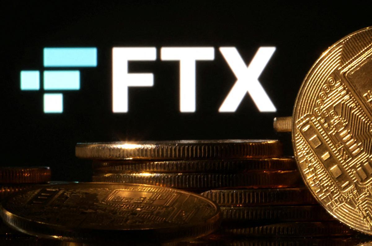 FILE PHOTO: Illustration shows FTX logo and representation of cryptocurrencies