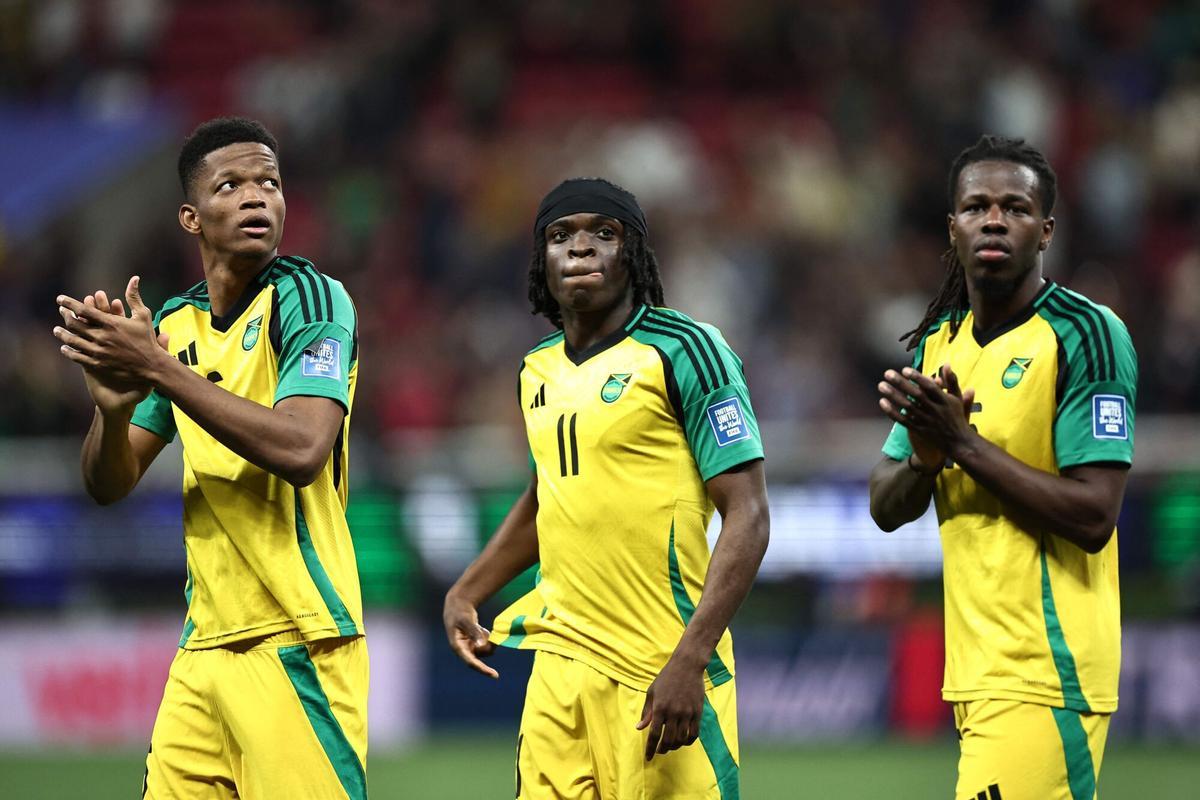 Players of Jamaica celebrate after winning the 2026 FIFA World Cup qualifiers semi-final playoff football match between New Caledonia and Jamaica at the Akron Stadium in Zapopan, Mexico on March 26, 2026. (Photo by Ulises Ruiz / AFP)