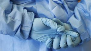rjulve27584927 the gloved hands of an army nurse are seen during a demonstr180918162113