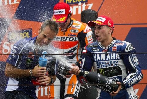 Yamaha MotoGP rider Lorenzo of Spain celebrates on the podium with champagne after winning the San Marino Grand Prix in Misano circuit in central Italy